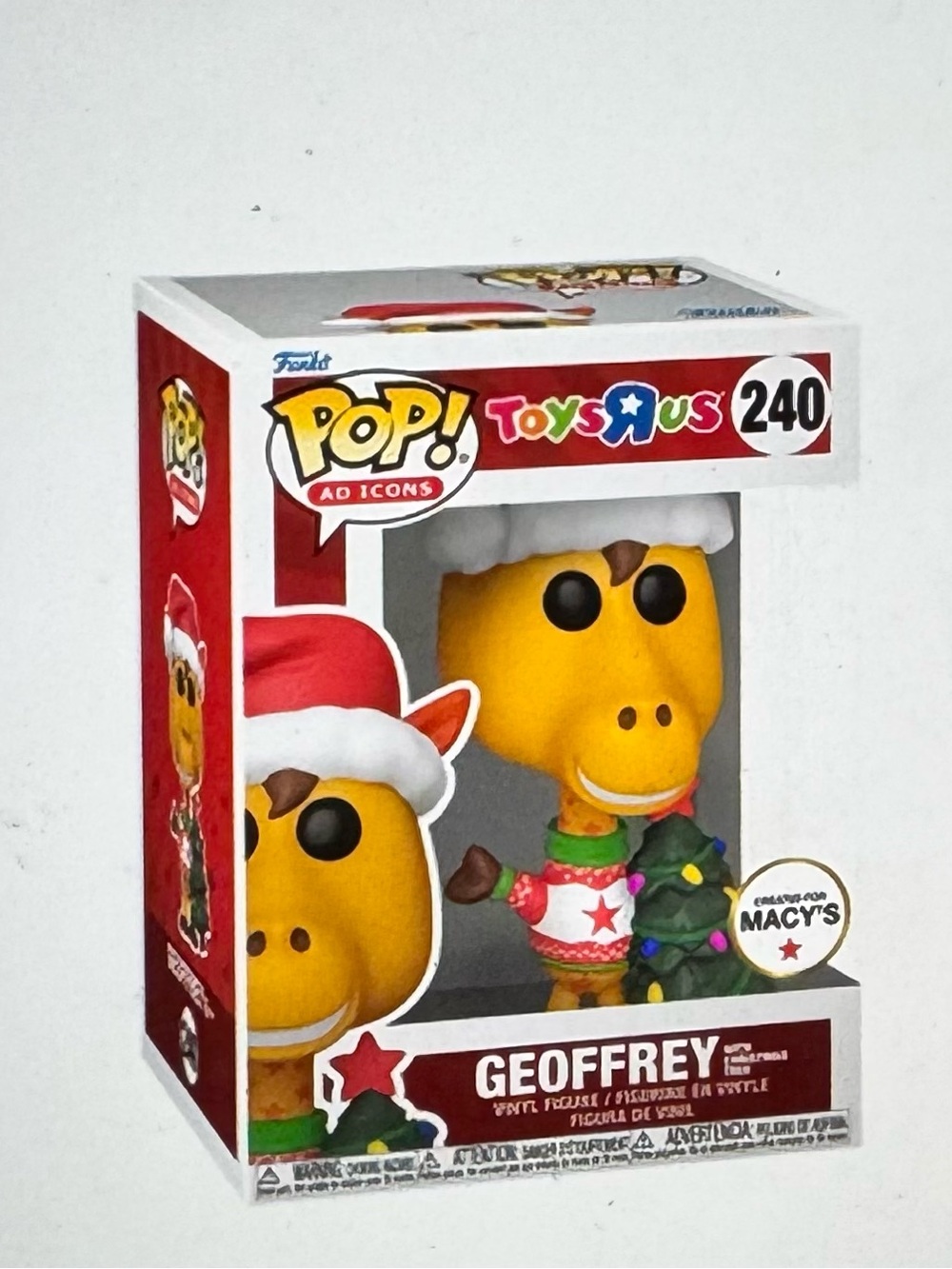Funko Pop! Toys"R"Us Geoffrey Holiday Figure - Yellow, Red, Green